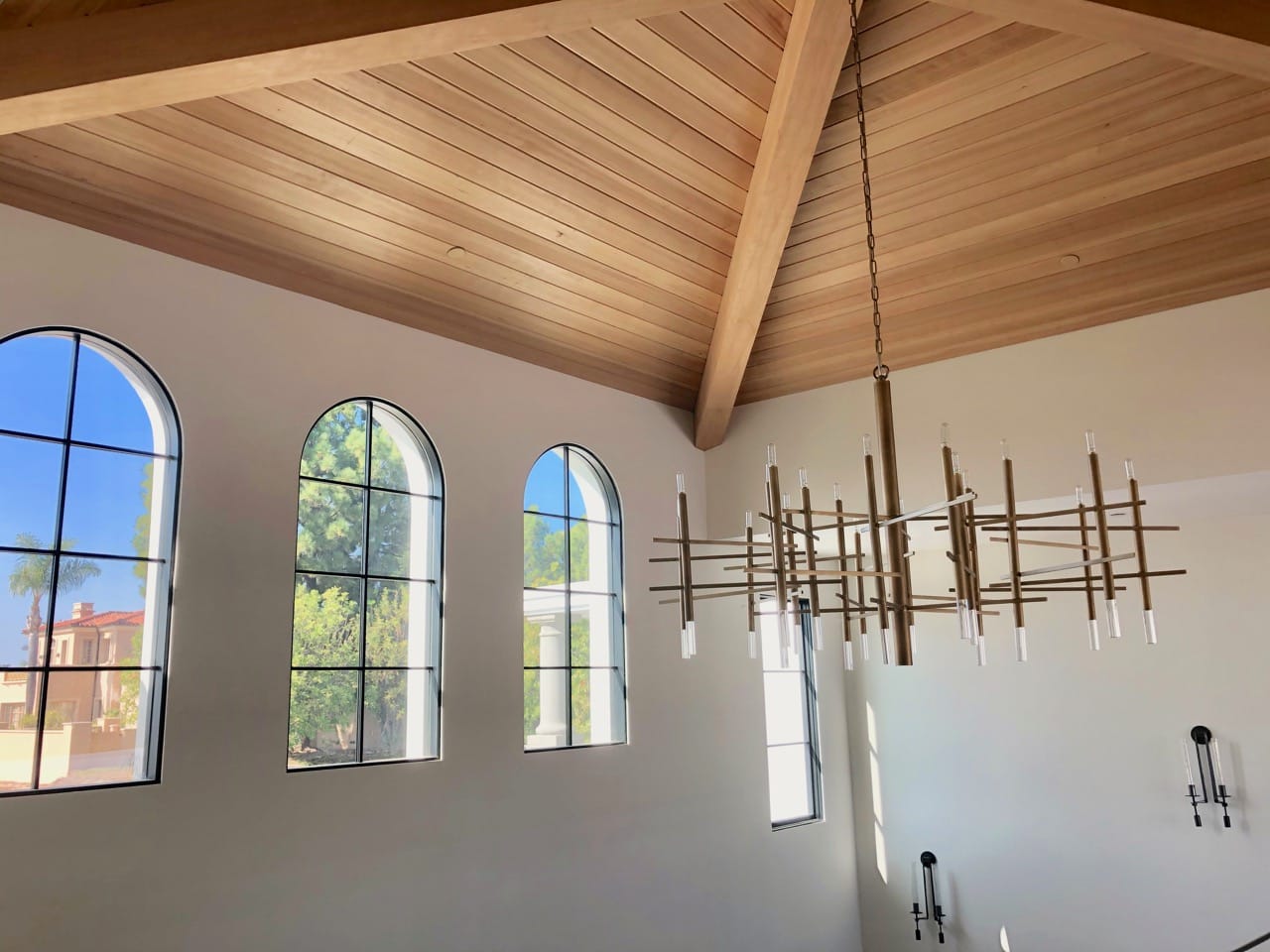 Wood entry tower with brass light fixture