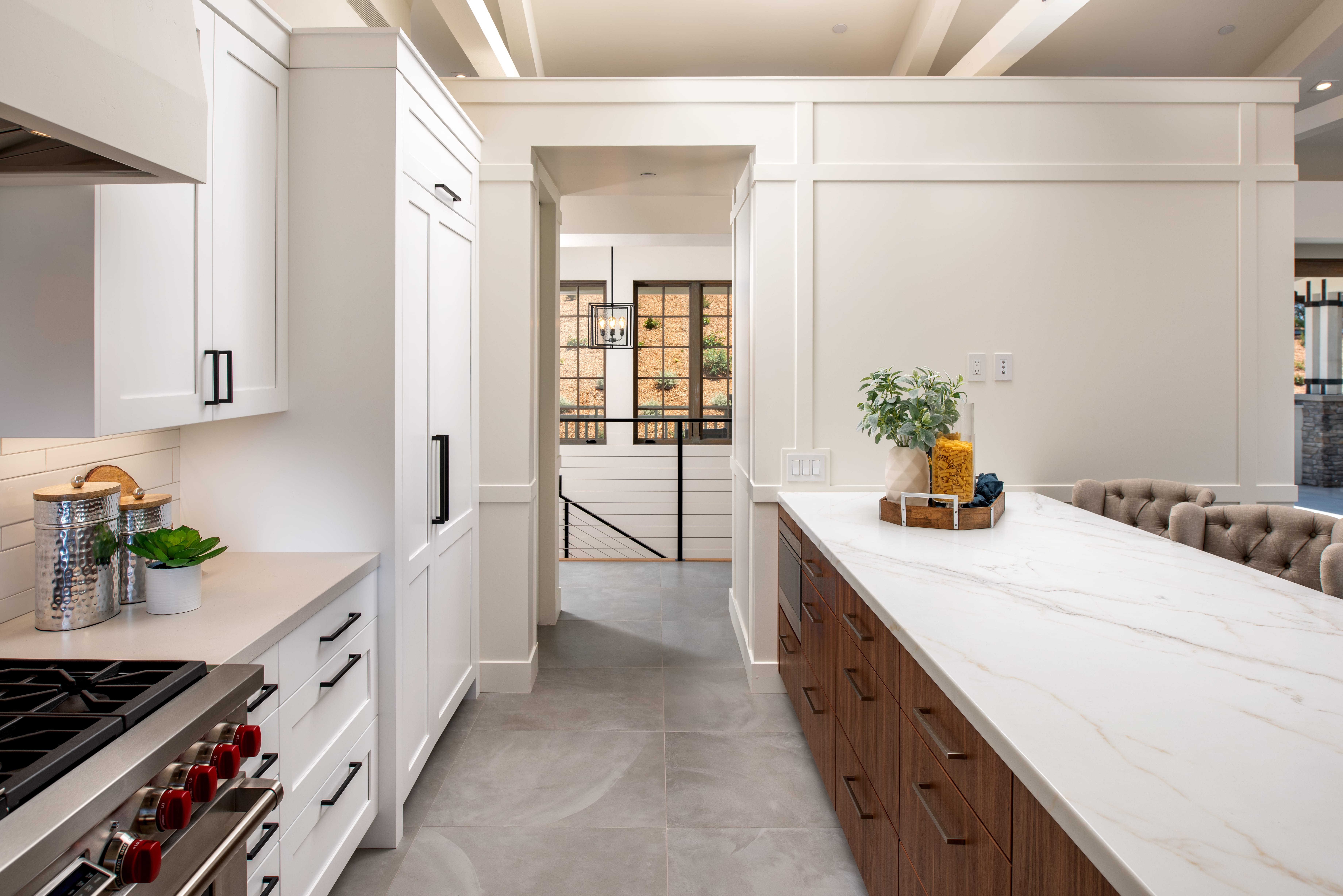 Kitchen with marble and walnut island design in Rancho Santa Fe